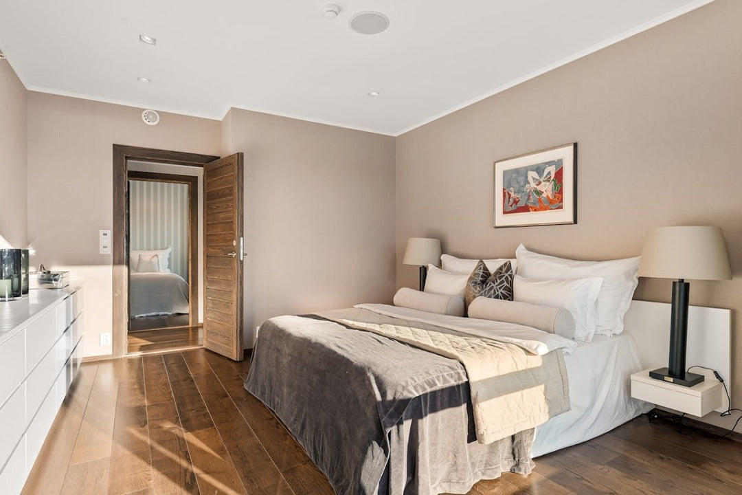 Well-designed bedroom showing queen bed placement for optimal room flow.