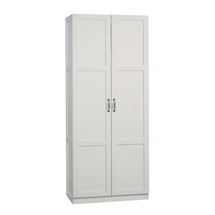 White storage cabinet with three doors on a white background