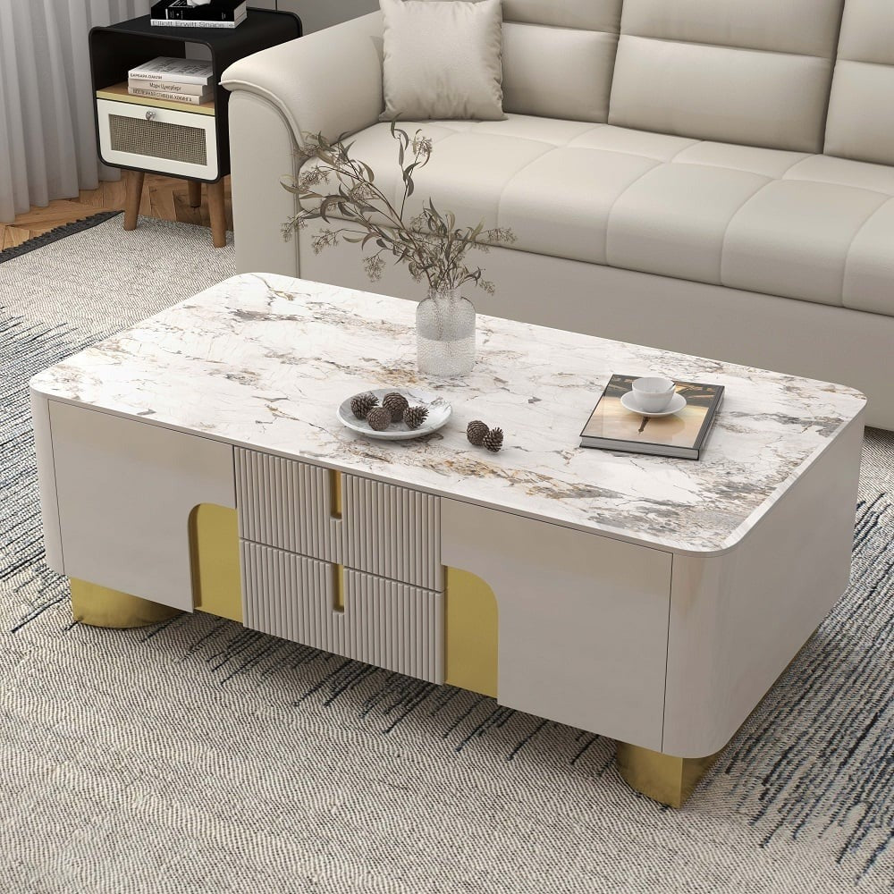 Beige Vista coffee table with premium stone top and spacious storage drawers, set in a modern living room