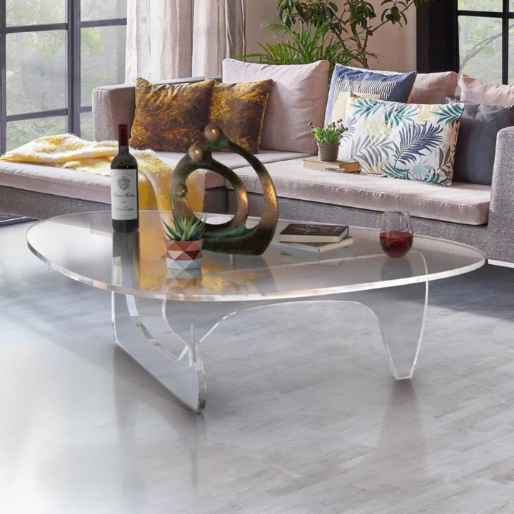 Clear acrylic Aurora coffee table paired with neutral decor, accentuating its optical lightness and minimal footprint.”