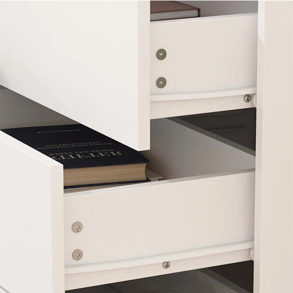 Close-up of Brians white sideboard drawers with smooth sliding mechanism, showing spacious interior storage for books and essentials.