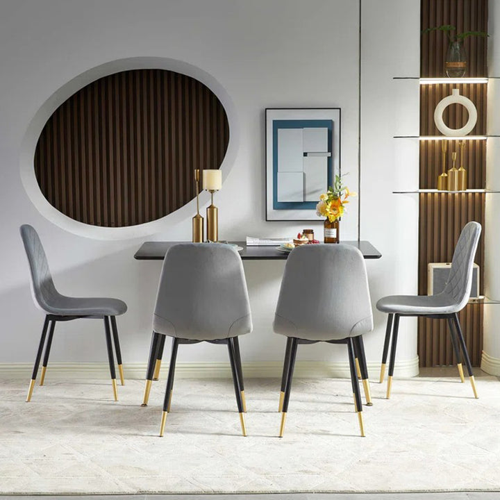 4-seater dining table is supported by black metal legs with 4 stylish dining chair