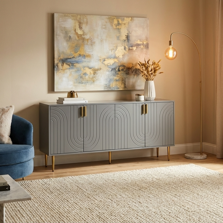 Living room with a stylish grey sideboard, blue sofa, and abstract painting on a beige wall.
