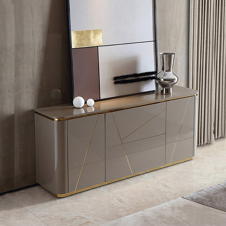 Grey Vint sideboard with PU-paint finish, gold accents, drawers and doors styled in a modern living room.