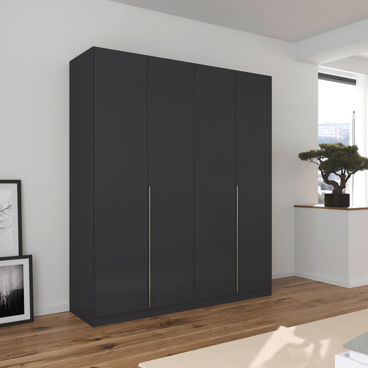 A matte black 4-door wardrobe with sleek handles, placed in a room with minimalist decor.