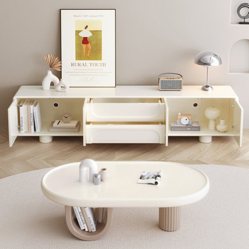 Modern white tv unit with open doors and drawers in a living room