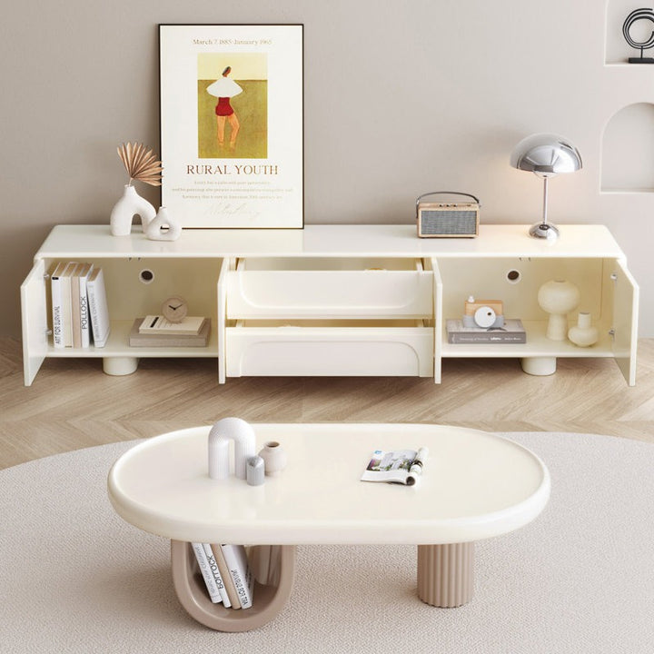 Modern white tv unit with open doors and drawers in a living room