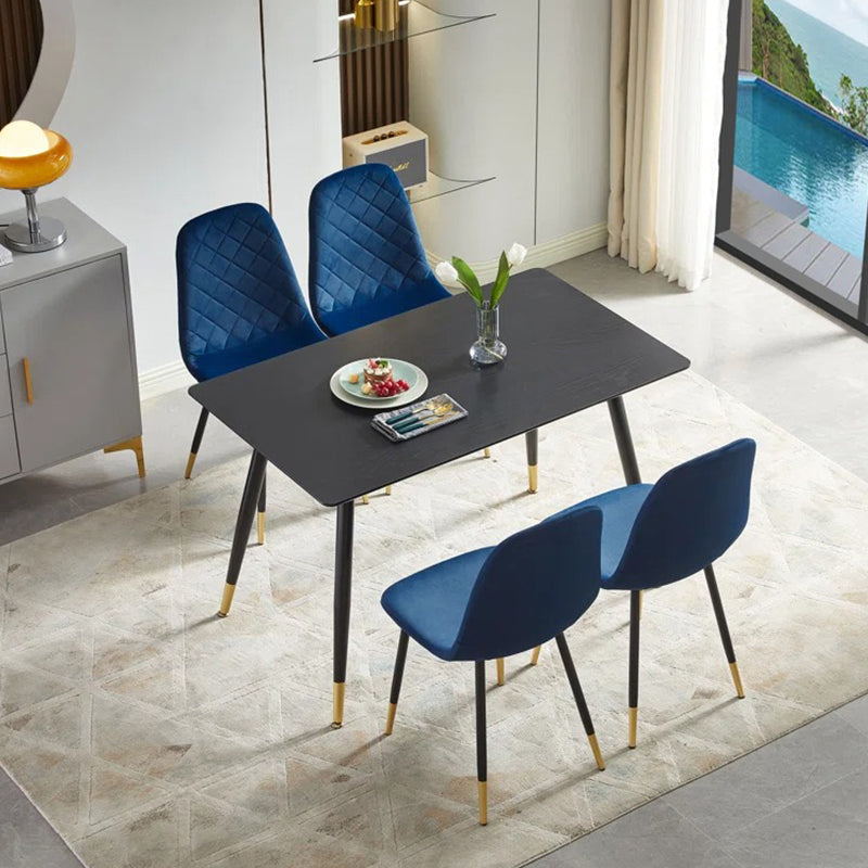 Stylish 4-seater dining table set in blue upholstery and sleek tabletop.