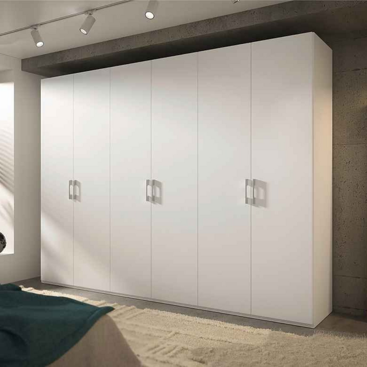 A matte white 6-door wardrobe with sleek silver handles, providing ample storage space for clothes and other items.