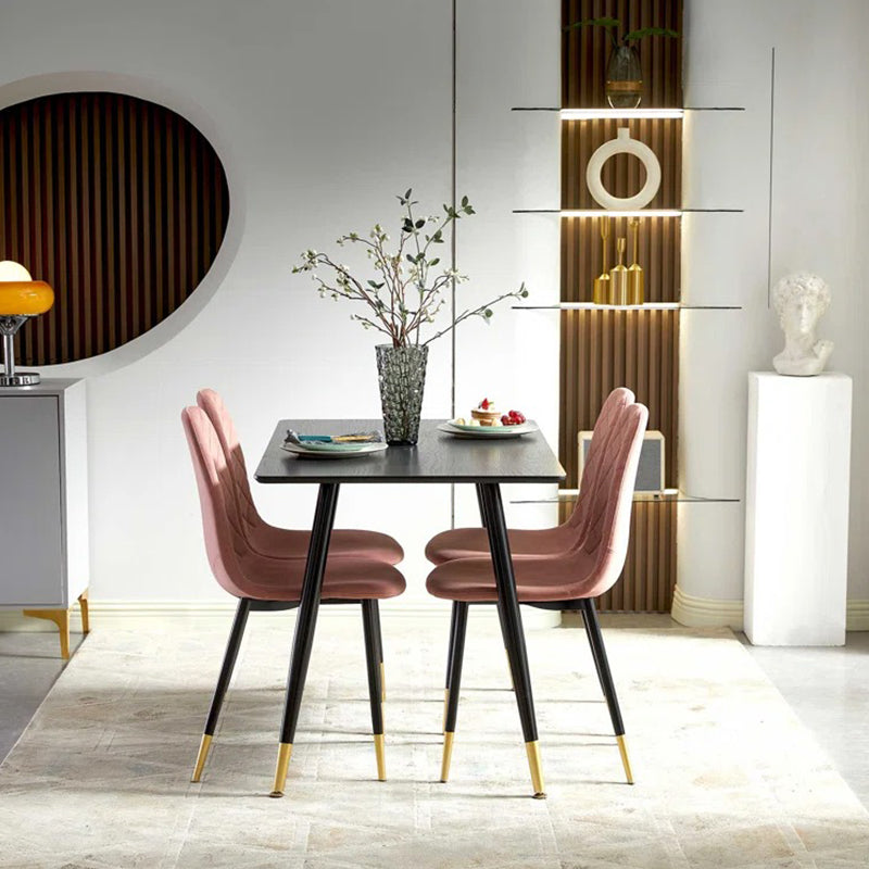 Black dining table with pink chair