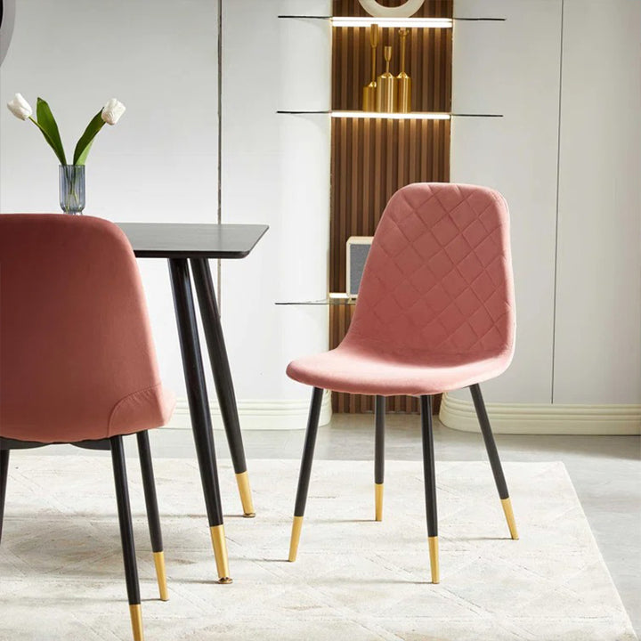 Pink four ergonomically designed dining chairs upholstered in high-quality fabric