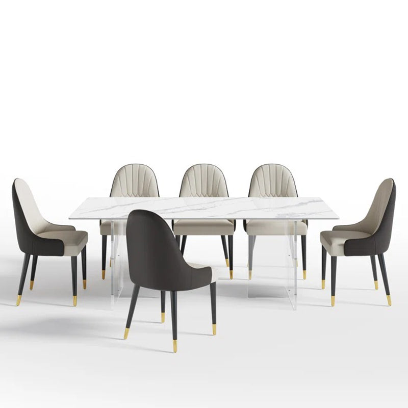 Modern 8-seater rectangular dining table set with scratch-resistant stone top and designer chairs.