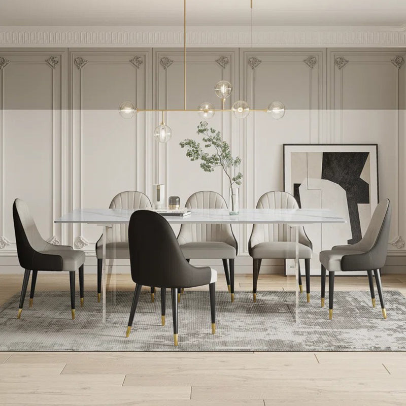 Luxury satvario stone 8-seater dining table set with marble top and upholstered leatherette chairs.