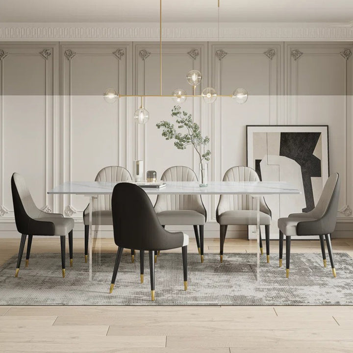 Luxury satvario stone 8-seater dining table set with marble top and upholstered leatherette chairs.