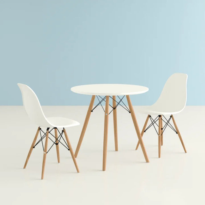 Round dining table with two chairs and a space-saving design for the kitchen.