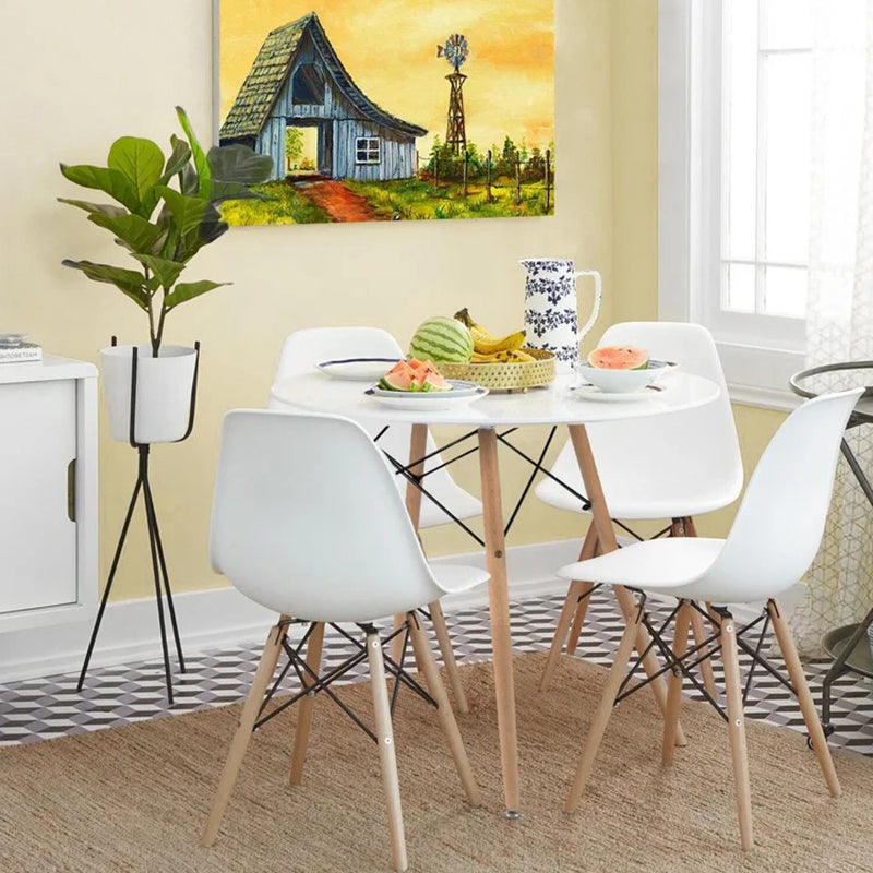Compact 4 seater dining table set with round table and space-saving chair storage design.