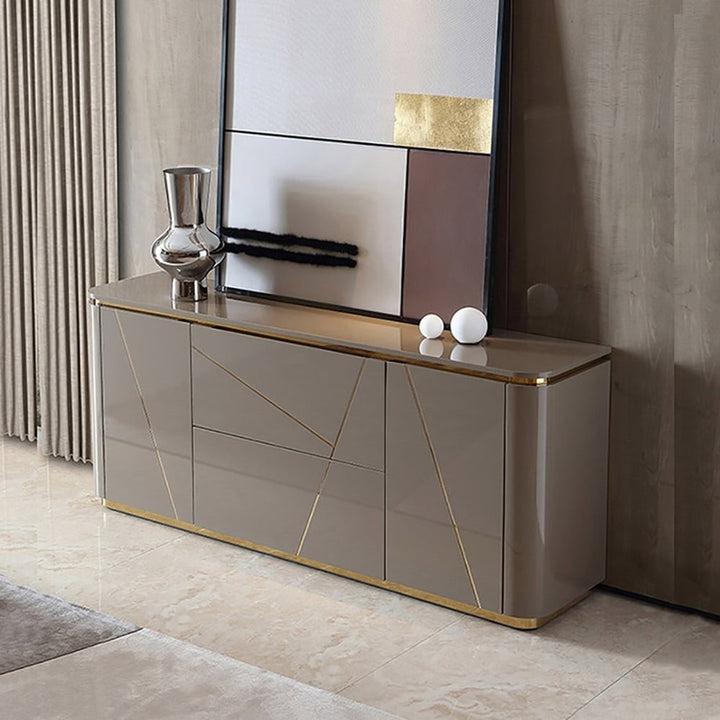 Vint sideboard small in grey high-gloss finish with gold base and symmetric door-drawer configuration.
