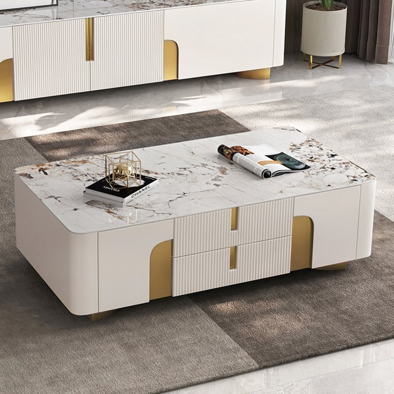 A modern beige coffee table with a premium stone top and spacios storage drawers, set in a room with contemporary furniture.