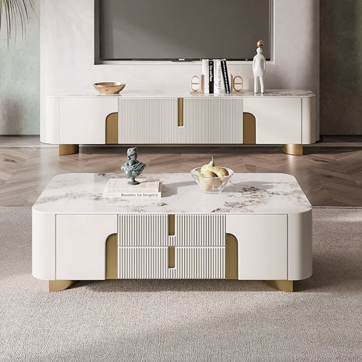 Vista beige coffee table with luxurious stone top and hidden storage drawers, styled in a modern living room setting.