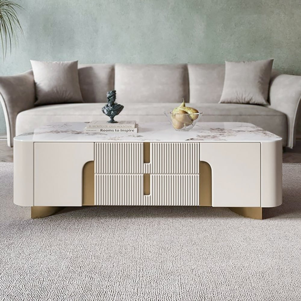 living room with beige Vista coffee table featuring a stone surface and elegant gold accents