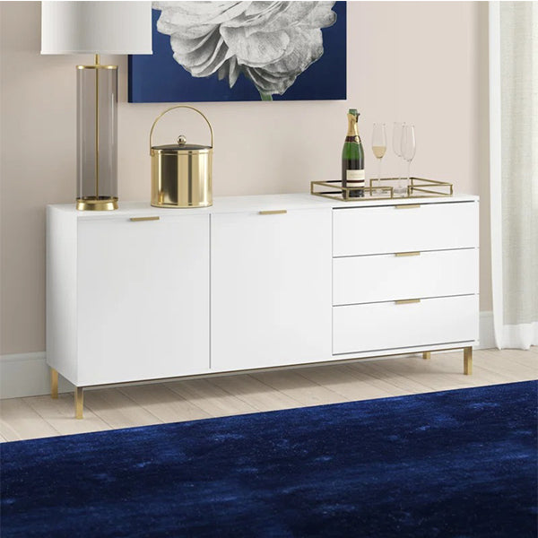 White Brians sideboard with gold accents, splayed legs, and sleek design displayed in a modern living room.