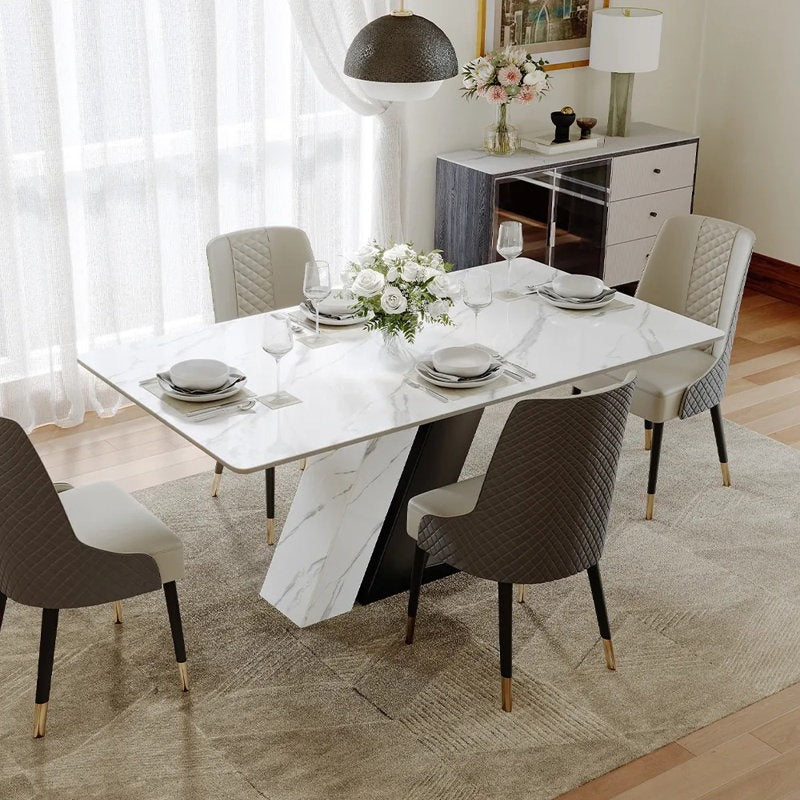 Modern 8-seater dining table set with a white marble top and black PU painted legs, featuring a dual-leg design with one leg being marble and the other metallic. 