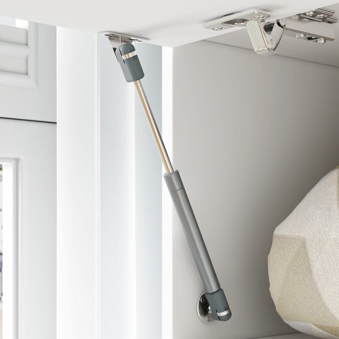 Cushioned hinge mounted on a cabinet door