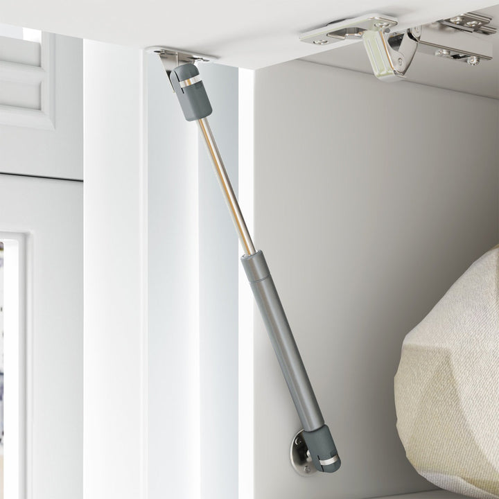 Cushioned hinge mounted on a cabinet door