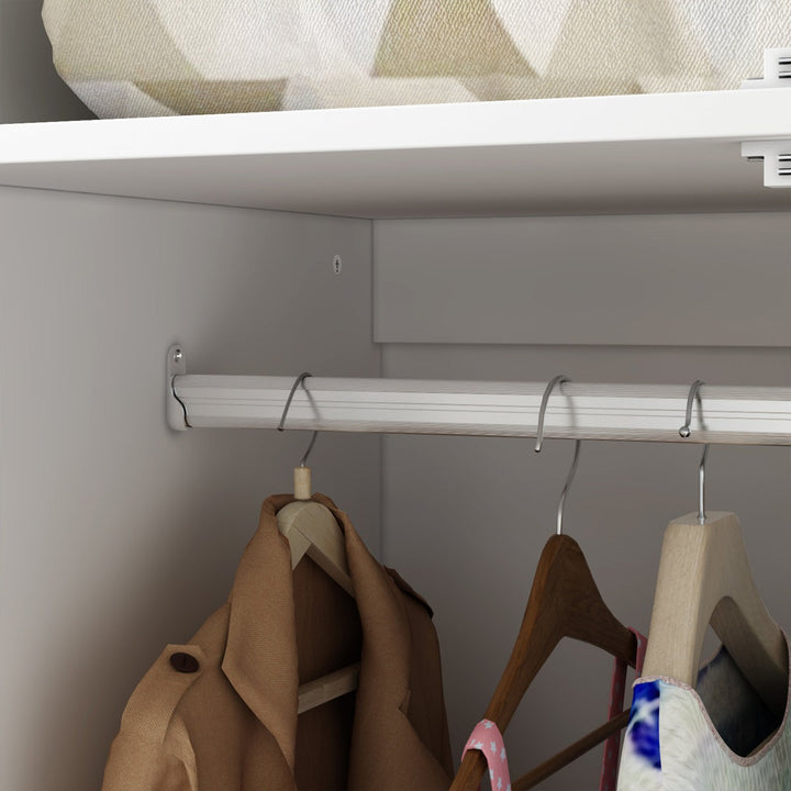 Clothing items hanging on a rod in a closet