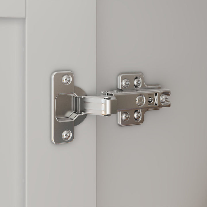 Metal cabinet hinge on a white door of wardrobe