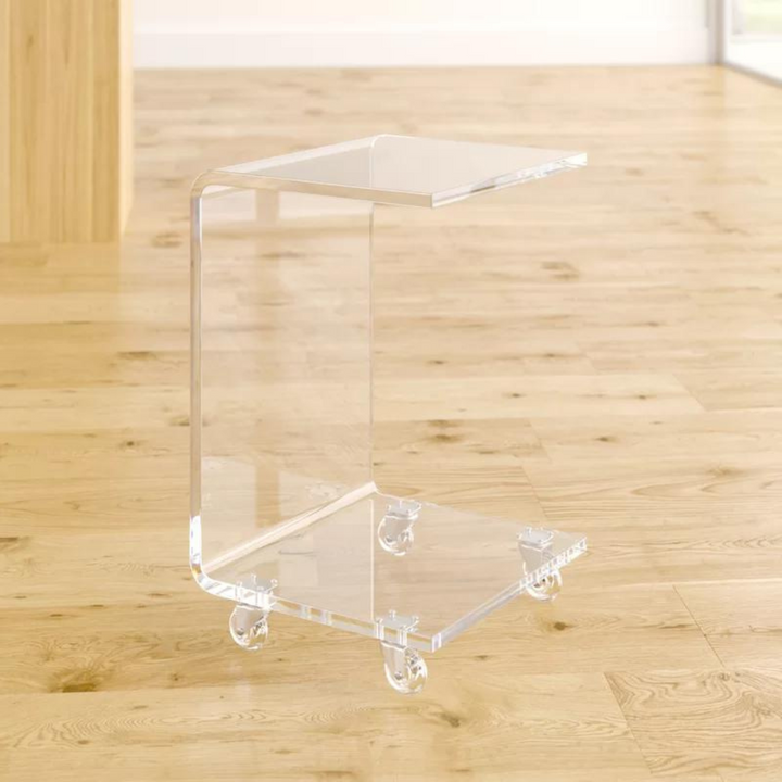 angled view of Chic Acrylic End Table in clear with C-shaped design