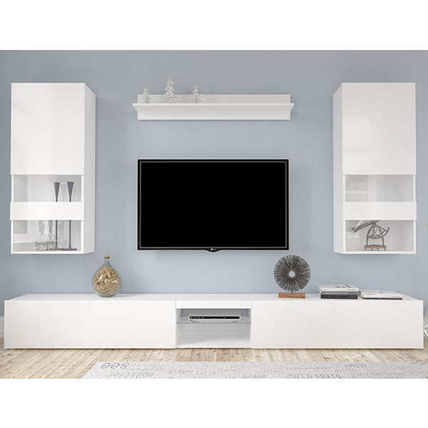 A white matte AOC TV unit set with storage spaces and a flat-screen TV, placed in a living room setting against a blue wall with decorative items on top.