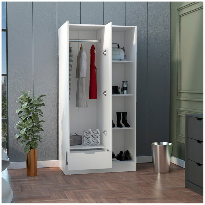 White modular wardrobe design with open doors displaying clothes and shoes in a room with gray walls and a plant.