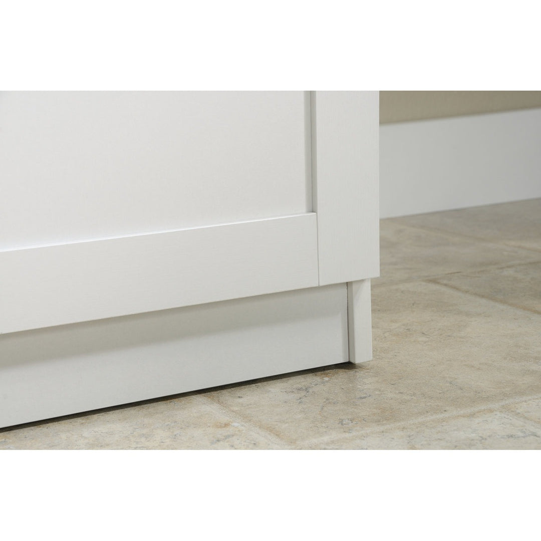 Close-up of a white 2-door wardrobe base on a light wood floor.