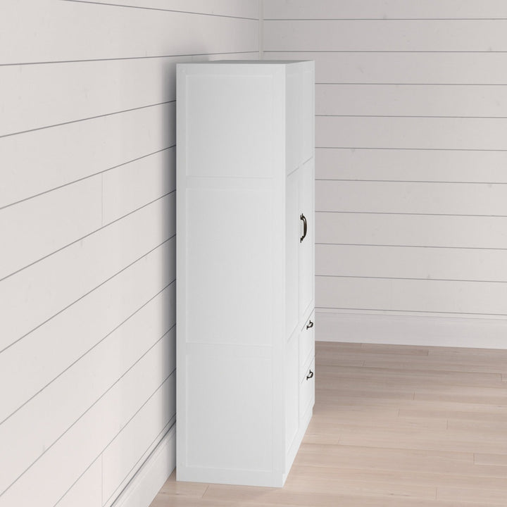 White 2-door wardrobe against a light wood paneled wall