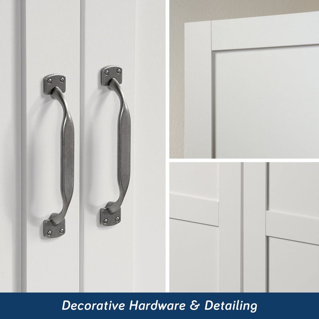 Decorative handles on a white cabinet with a focus on hardware and detailing.