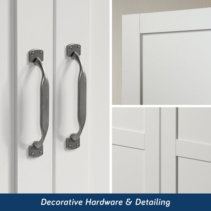 Decorative handles on a white cabinet with a focus on hardware and detailing.