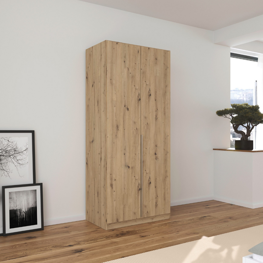 A 2-door wardrobe with a beech wood finish, featuring integrated handles and internal shelves, set in a room with minimal decor.
