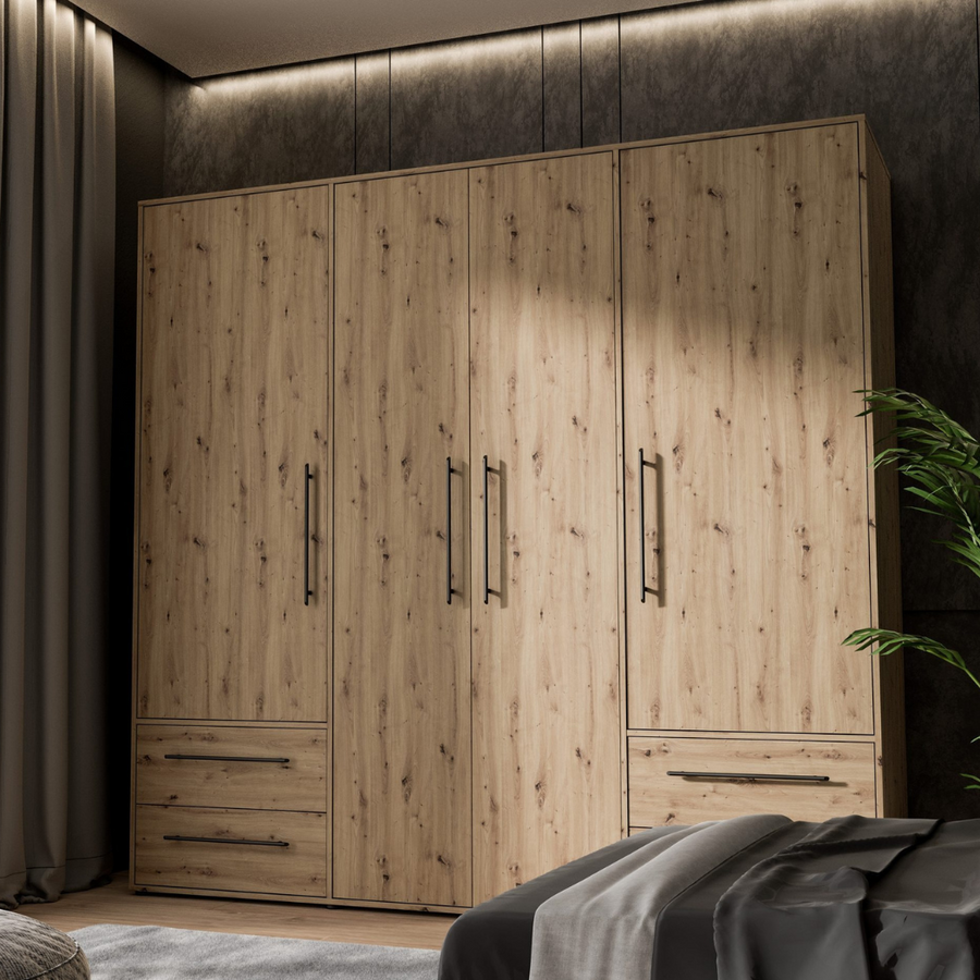 A beech finish 4-door wardrobe with drawers and 8 steel handles, placed in a bedroom setting.