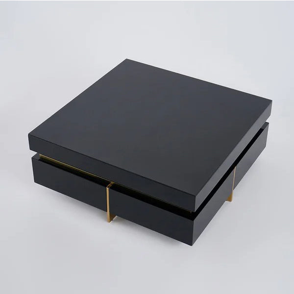 Black Nadu coffee table made of high-quality MDF with PU-painted surface and elegant gold metal legs.