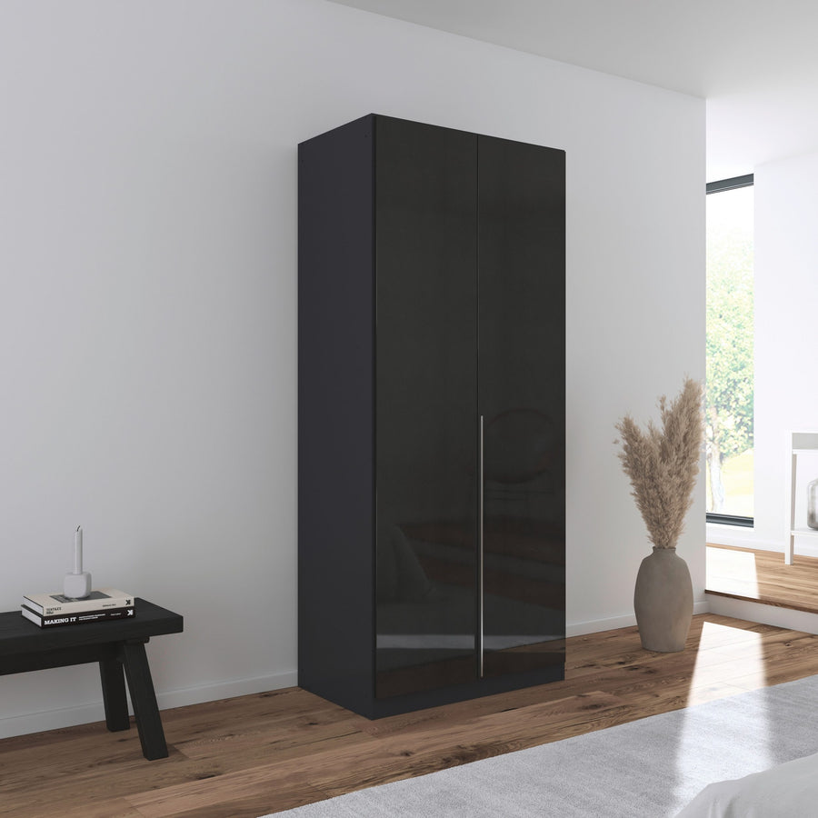 A sleek black gloss 2-door wardrobe with integrated handles in a modern room.