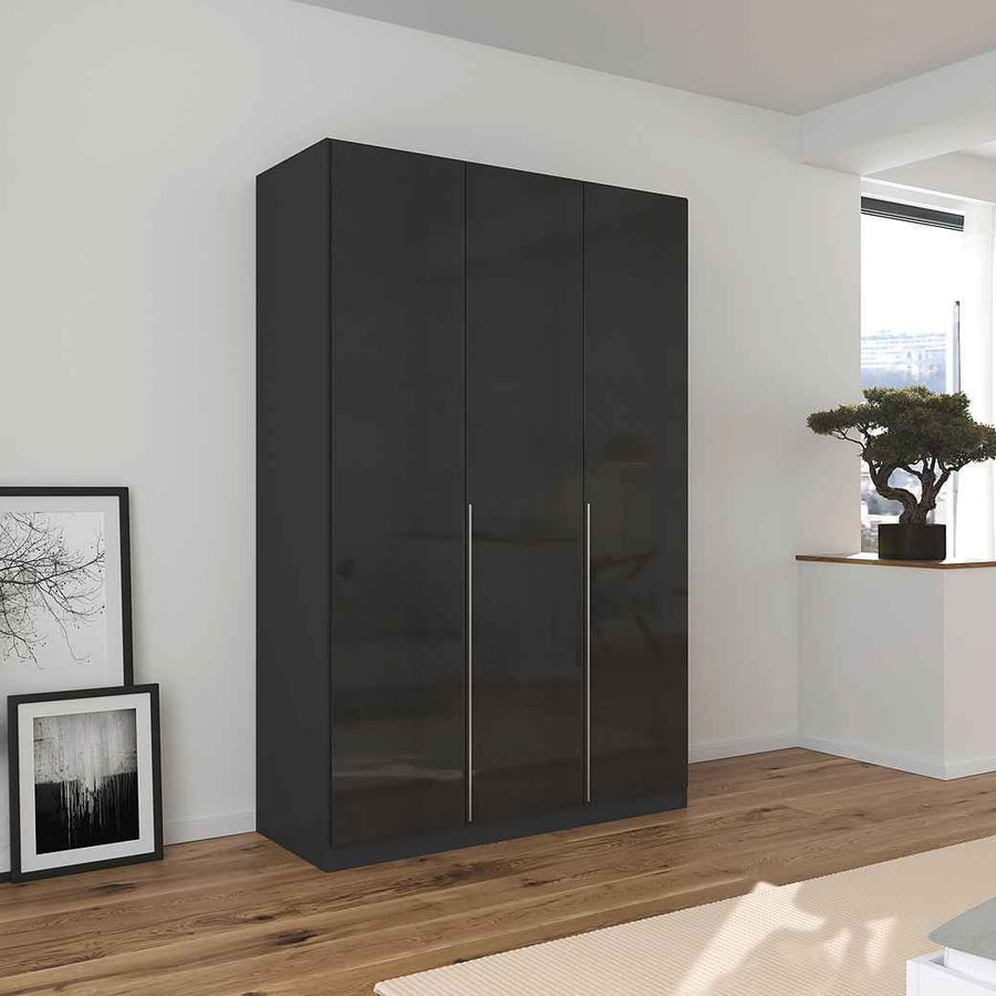 A sleek black-gloss 3-door wardrobe with integrated handles, situated in a modern room setting with minimalistic decor.