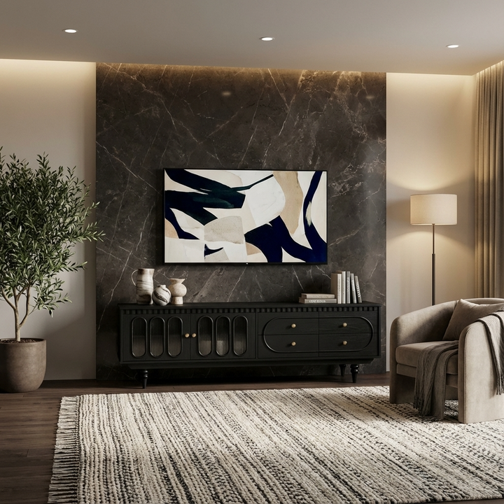 Modern living room with a premium black TV unit, abstract painting, and decorative items.