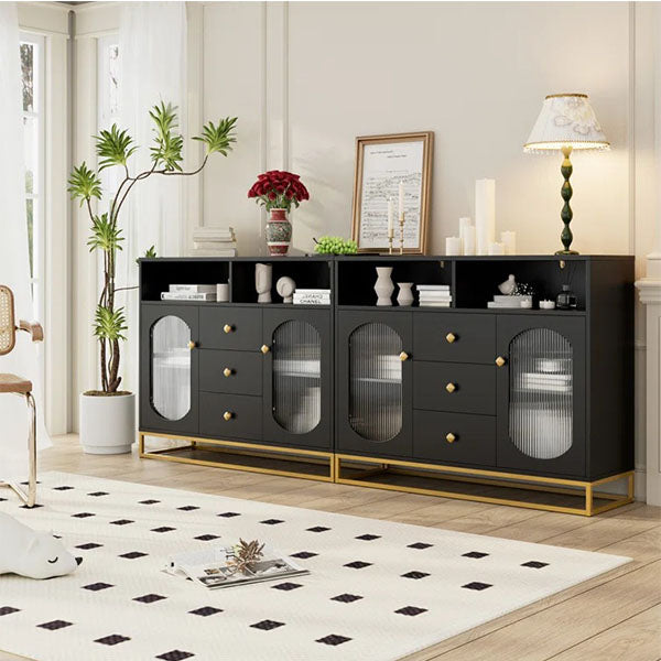 black sideboard shown from an angle to highlight its clean-lined silhouette and elevated metal base