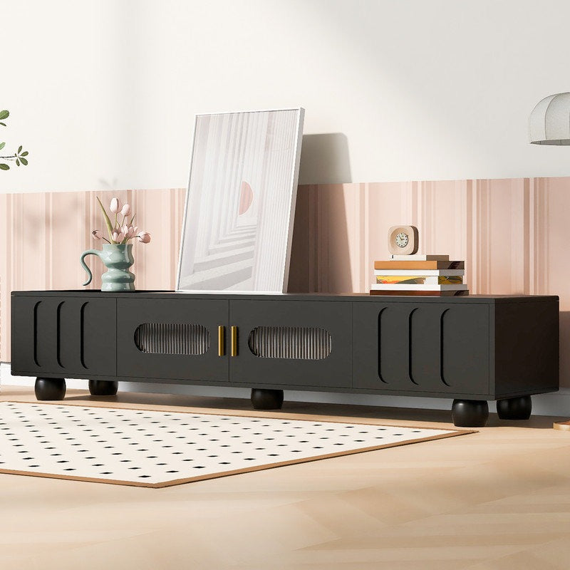 A sleek black Stic TV stand with dual doors and two drawers, featuring an elegant arched design with Changhong tempered glass. The TV stand is positioned in a modern living room setting.