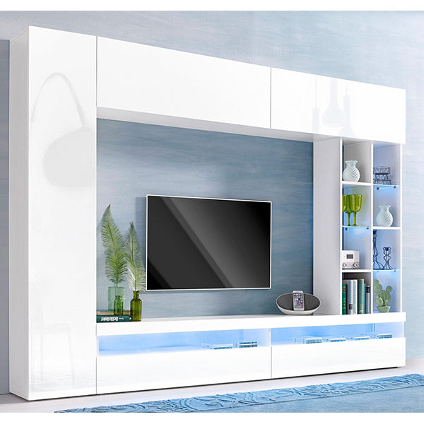 A white matte TV unit set with a flat-screen TV on top, positioned against a blue wall with a shelf of decorations and books to the side.