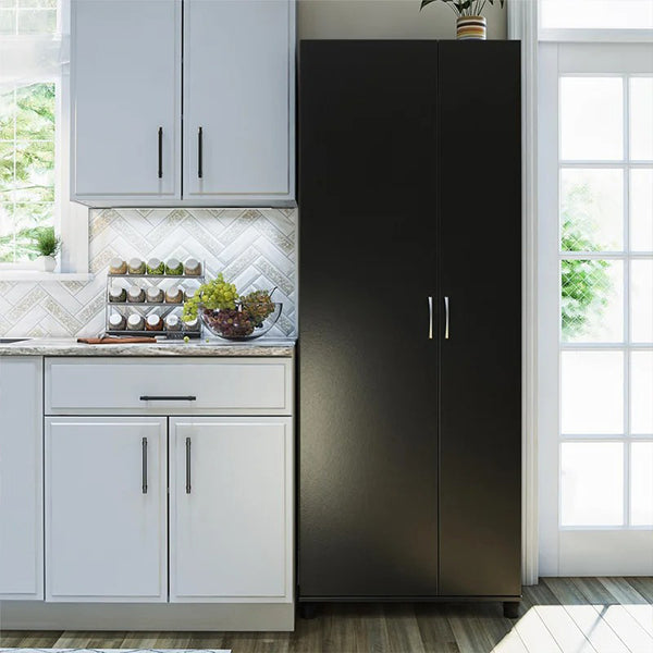 black cabinet with metal handles in a kitchen for storage