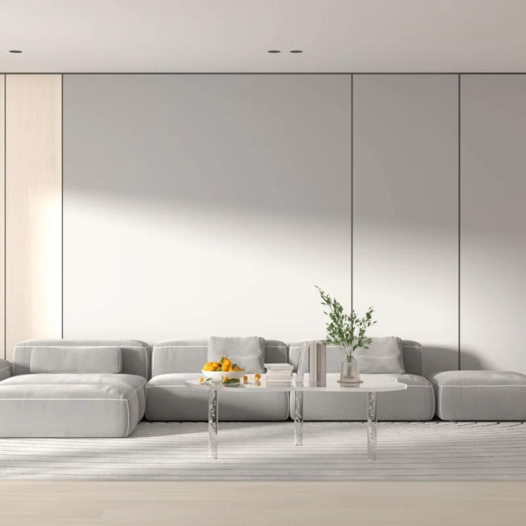 Echo acrylic coffee table clear in cloud shape with bubble-decorated legs and transparent body styled in a contemporary living room.