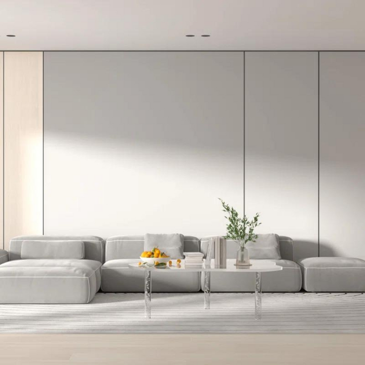 Echo acrylic coffee table clear in cloud shape with bubble-decorated legs and transparent body styled in a contemporary living room.