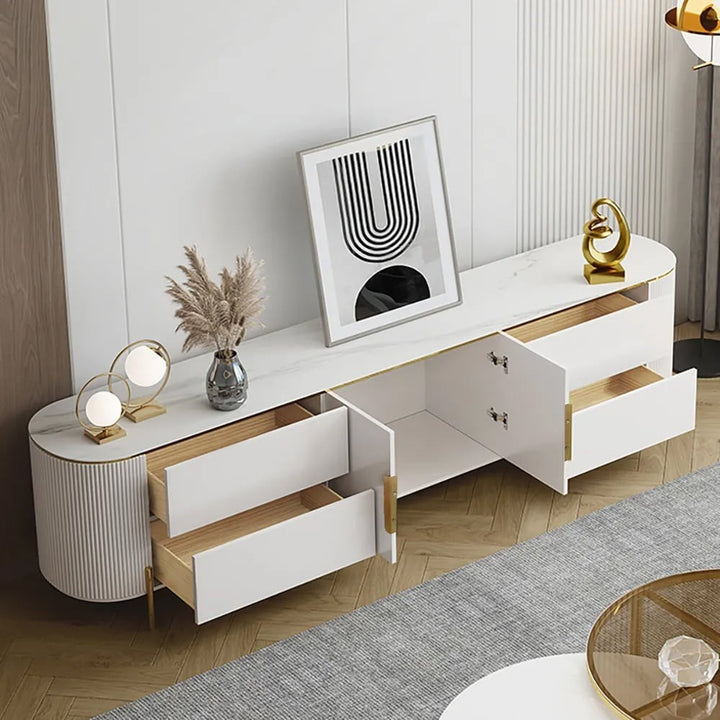 Modern white TV stand with open drawers and doors to show internal storage in a modern living room.